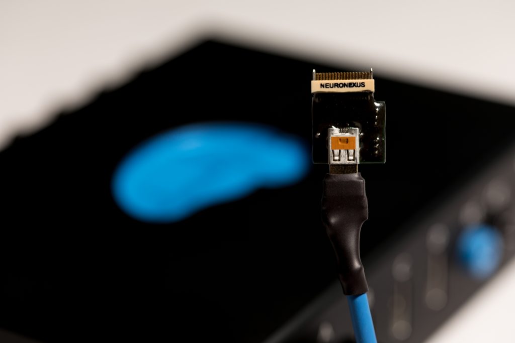 SmartLink Headstage on a SmartLink cable in front of a SmartBox Pro